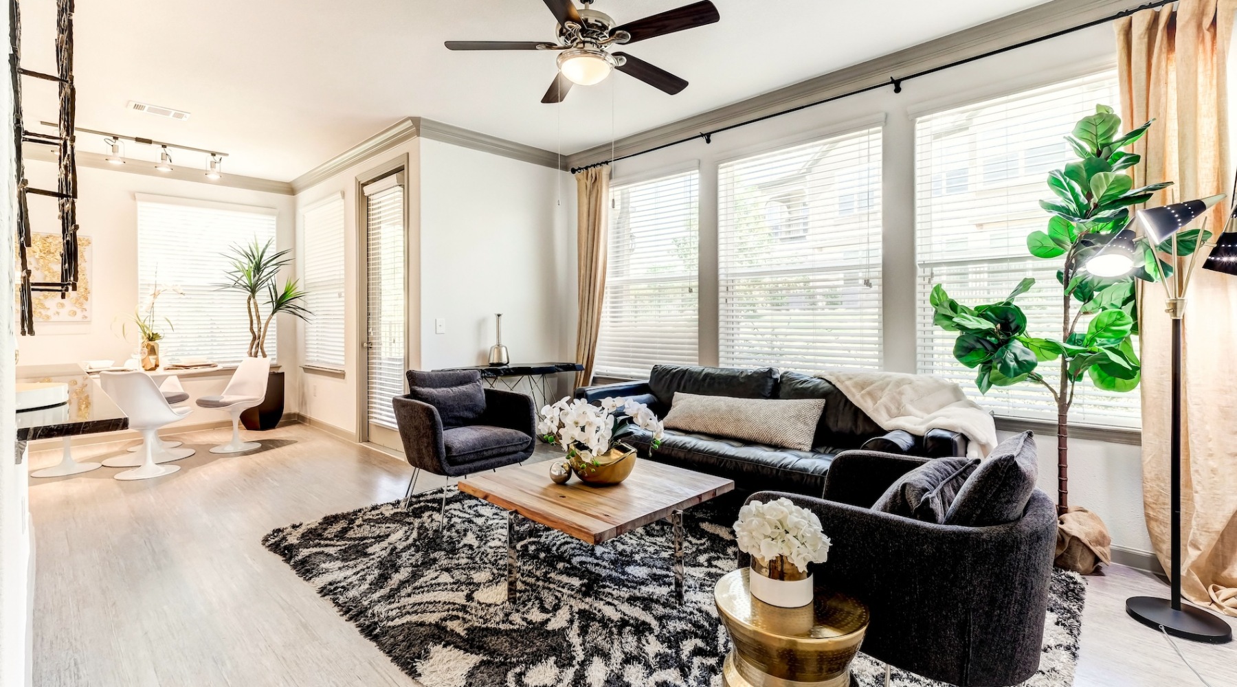 living room with a large window and open spaces