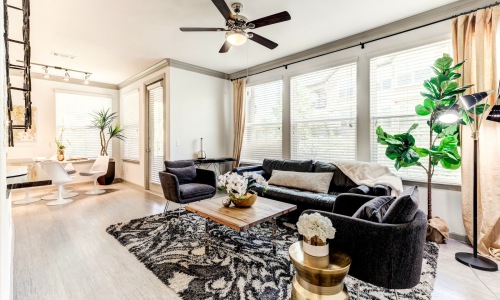 living room with a large window and open spaces