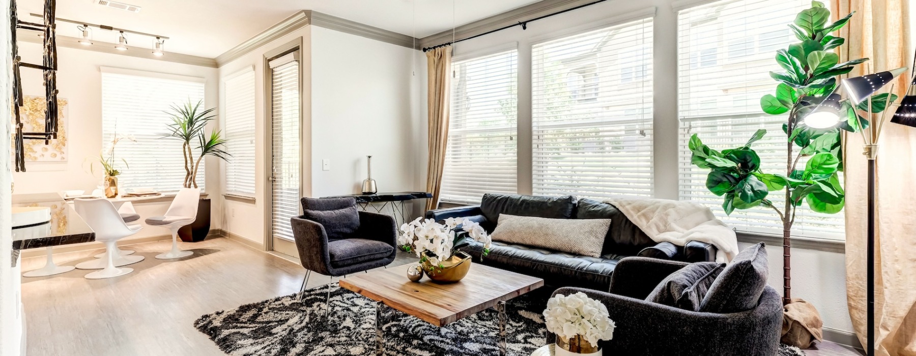 living room with a large window and open spaces