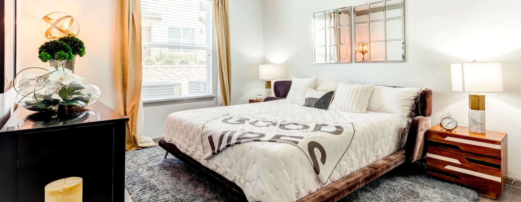 bedroom with a large window and modern decor