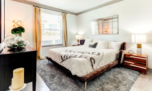 bedroom with a large window and modern decor