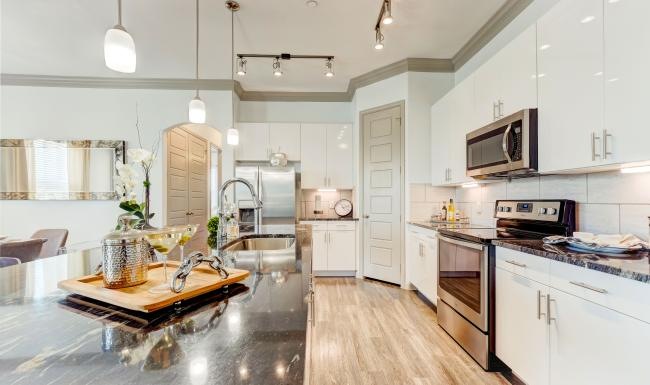 a kitchen with white cabinets