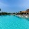 a swimming pool with lounge chairs