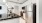 a kitchen with a stainless steel refrigerator