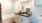 a bathroom with a tub sink and a mirror